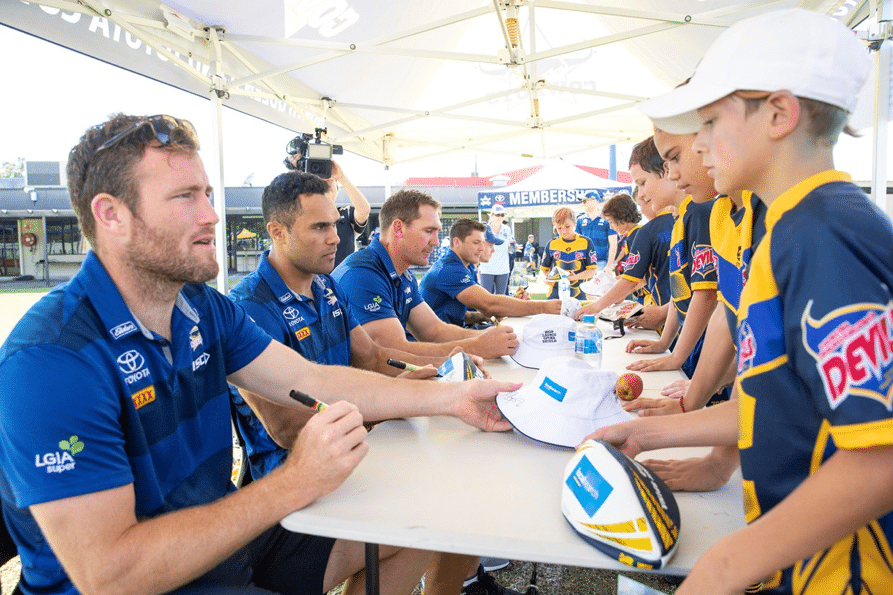 Cowboys players signing merchandise