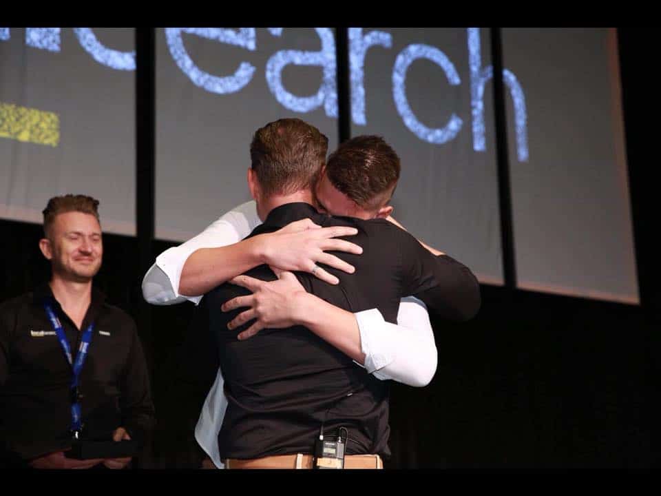 Localsearch conference staff hugging