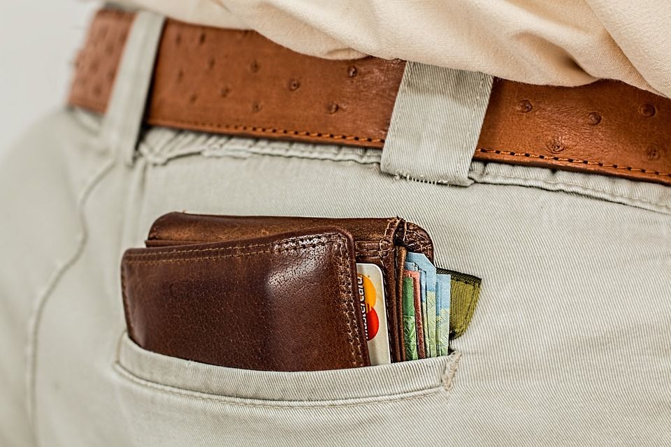 Wallet in back pocket with money