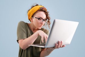 Frustrated women on computer learning how to remove a review