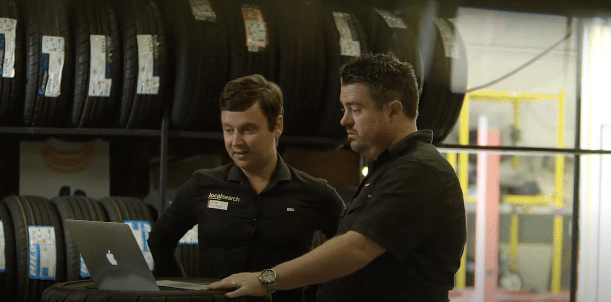 two men in a tyre shop