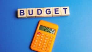 Orange Calculator on Blue Background Budget