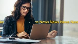 Woman reading news on laptop find out latest news July 2022 - Localsearch QLD